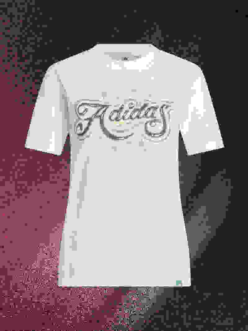 A white t-shirt with the word "Adidas" written in a stylized, colorful font against a dark, textured background.