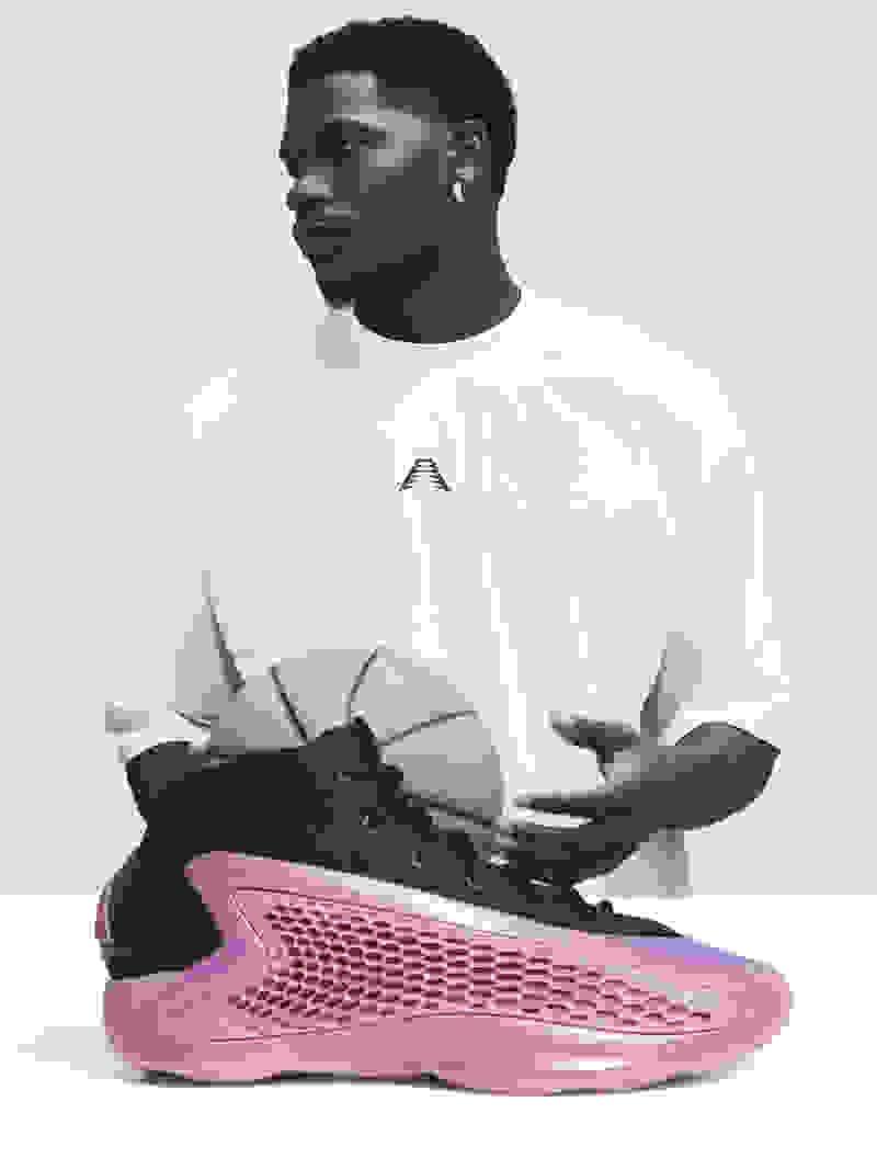 Portrait of Anthony Edwards with black and purple basketball shoe superimposed