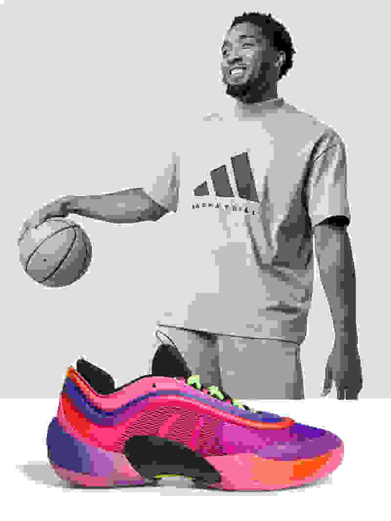Donovan Mitchell playing basketball, smiling. Pink Don Issue #6 shoe 