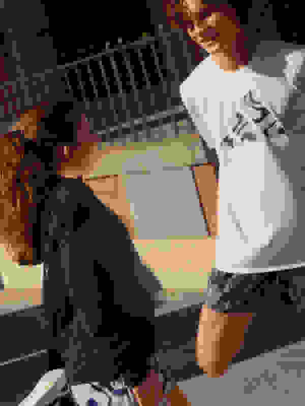 Two friends stretching before their run.