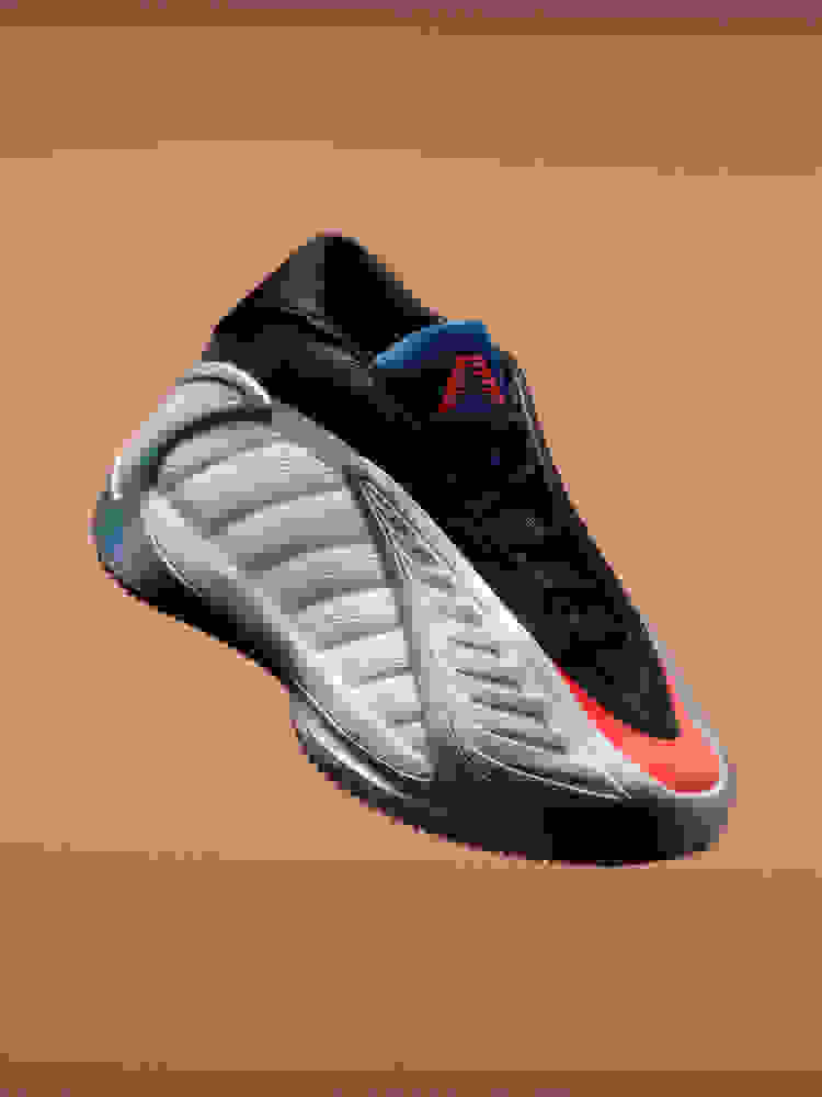 Đôi giày bóng rổ adidas Anthony Edwards 2 màu đen, xám và đỏ, nổi bật trên nền màu cam. Giày có đế giày chạm khắc và thiết kế gợn sóng.