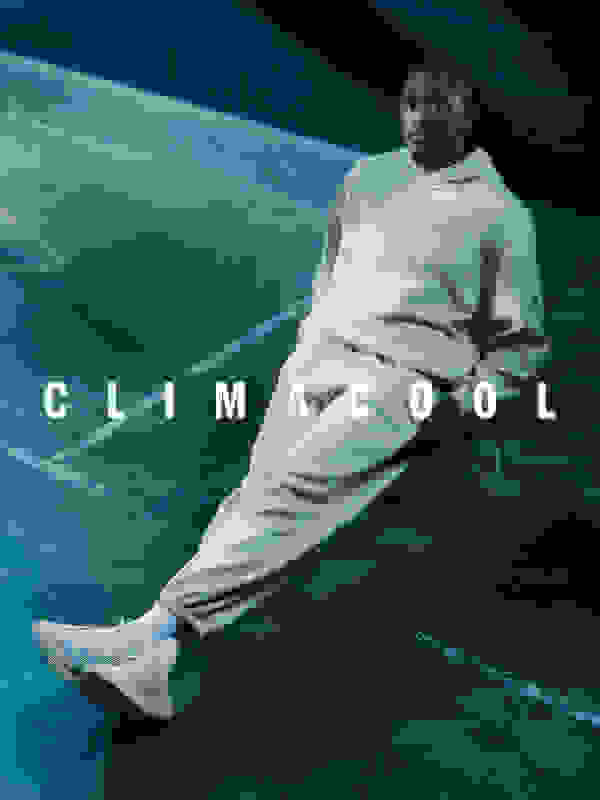 Jalen Williams wears a beige hoodie and joggers. He leans back on a chair in a concrete room, wearing beige adidas Climacool laced trainers. The word "CLIMACOOL" is overlaid in white text.