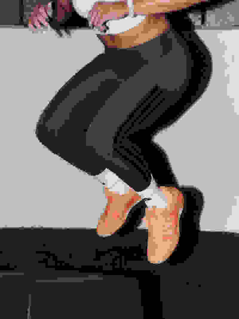 An image of an athlete jumping and wearing the new Dropset 4 strenght training shoes.