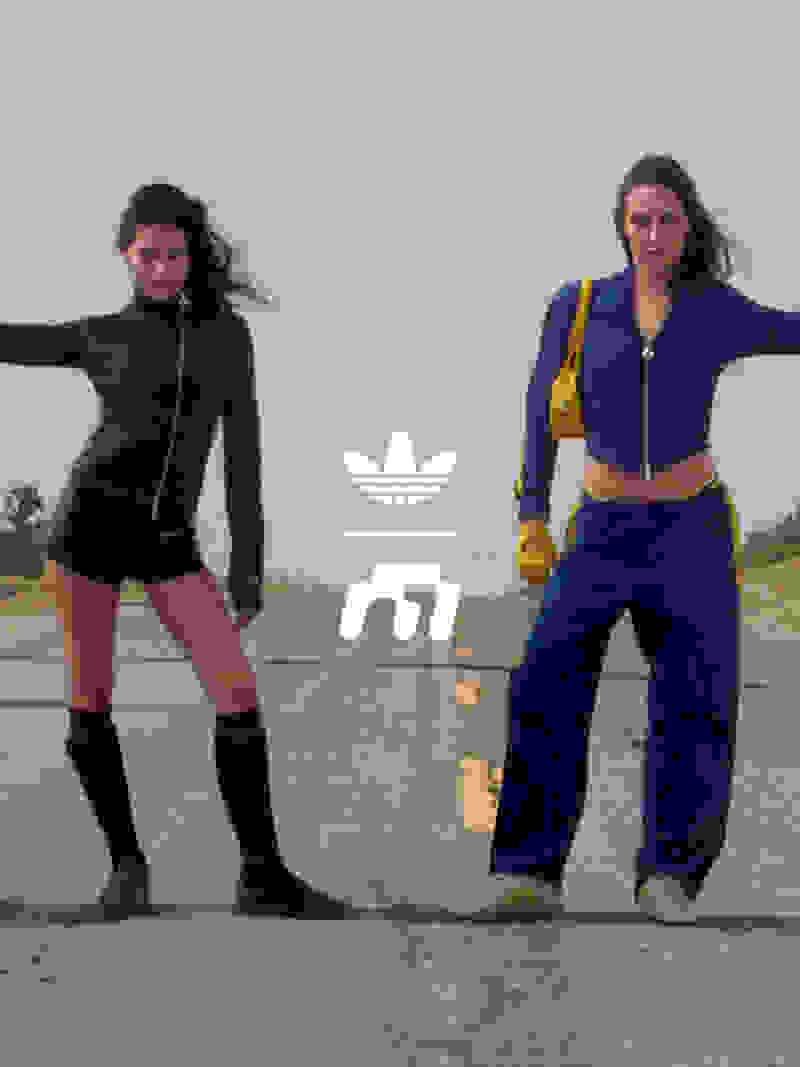 Devon Lee Carson and Gabbriette wear adidas Originals x Miaou, hitchhiking along a dusty desert road under the bright sun. 