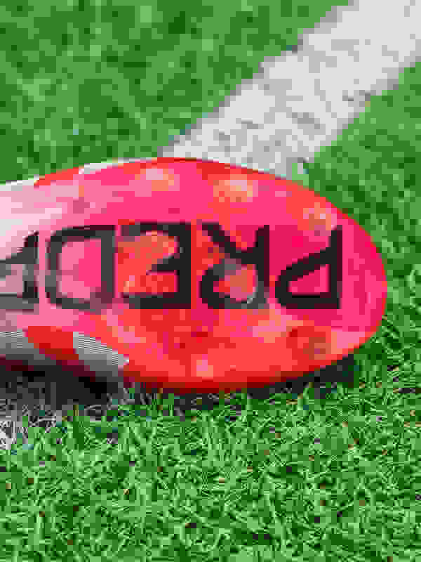 An outsole of an adidas football boot made to be played on artificial grass