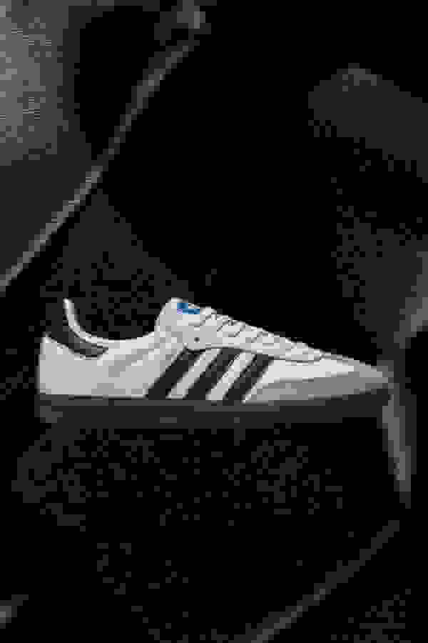 Side view of white Samba adidas sneaker.