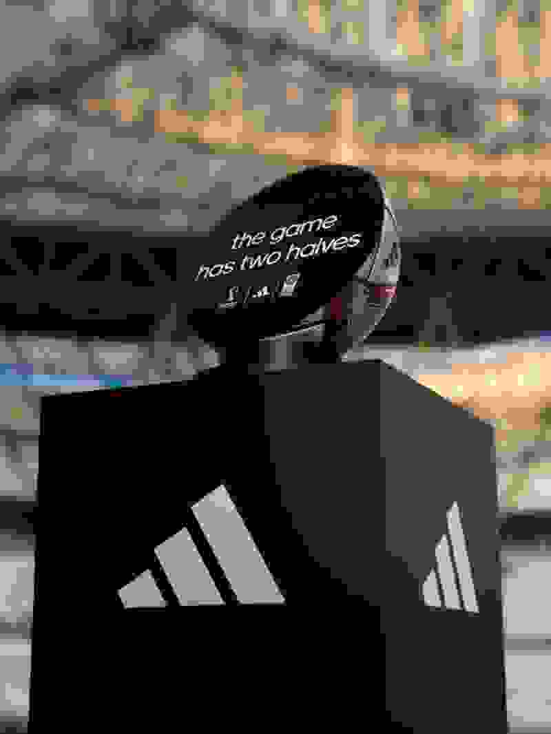 A podium with a half of the football ball on it