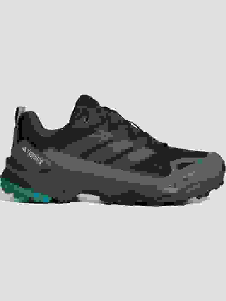 A pair of black and teal-colored Adidas Terrex hiking shoes on a plain background.