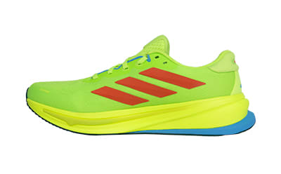 A bright green and yellow athletic shoe with red accents, set against a plain white background.