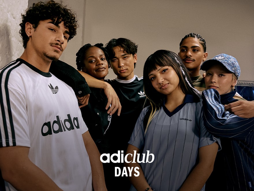 Six people wearing adidas Originals closely huddled in a neutral space and looking straight into the camera.