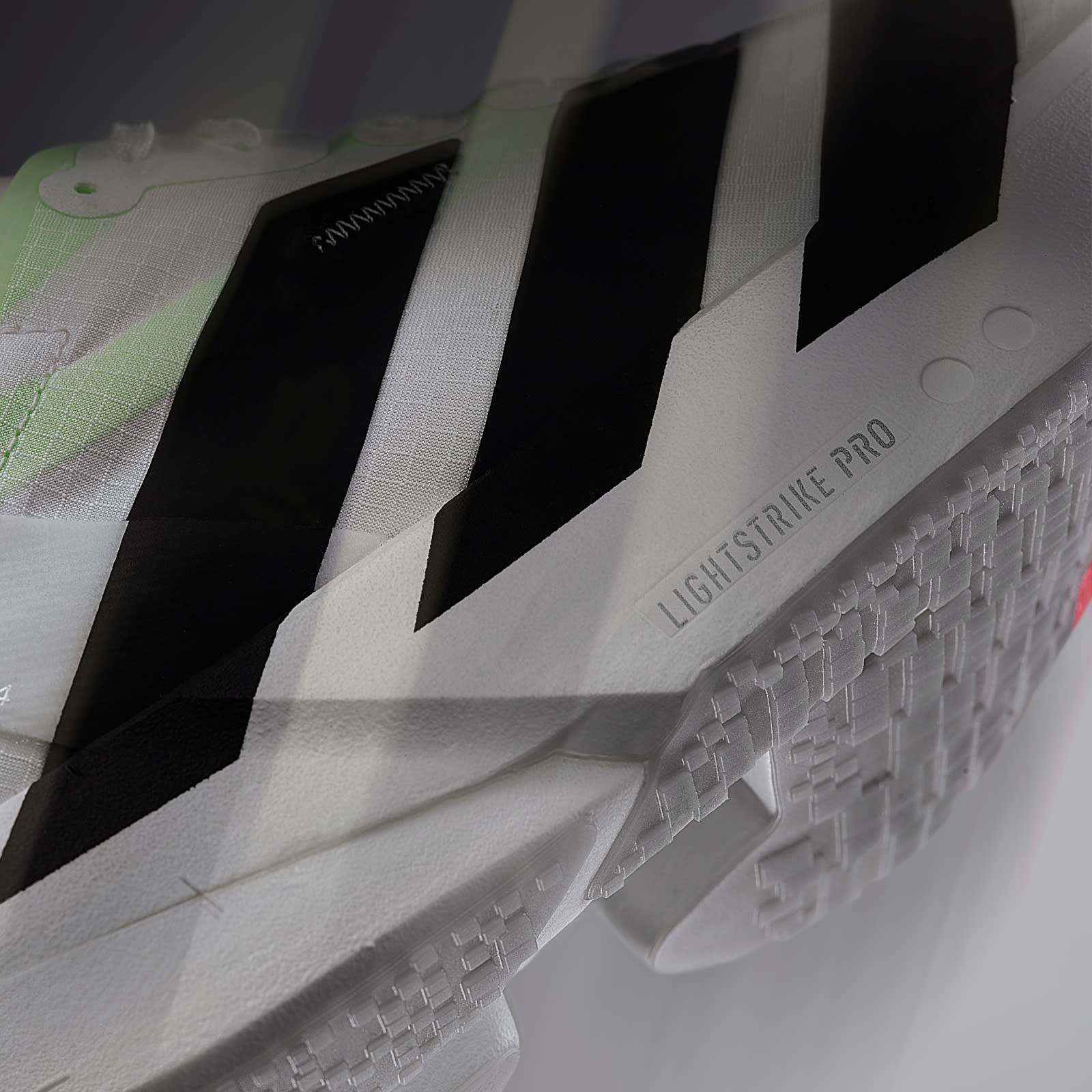 The image shows a close-up view of a gaming controller, with its distinctive black and white design and the "Lightstrike Pro" branding prominently displayed.