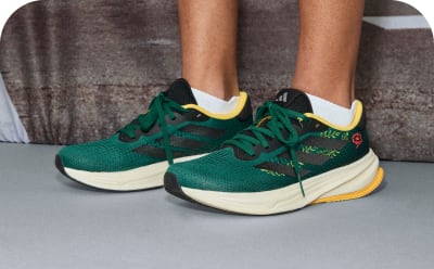 A close-up of someone’s feet wearing a pair of adidas Supernova Rise W Earth Day shoes.