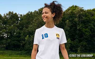 Girl in a football shirt smiling
