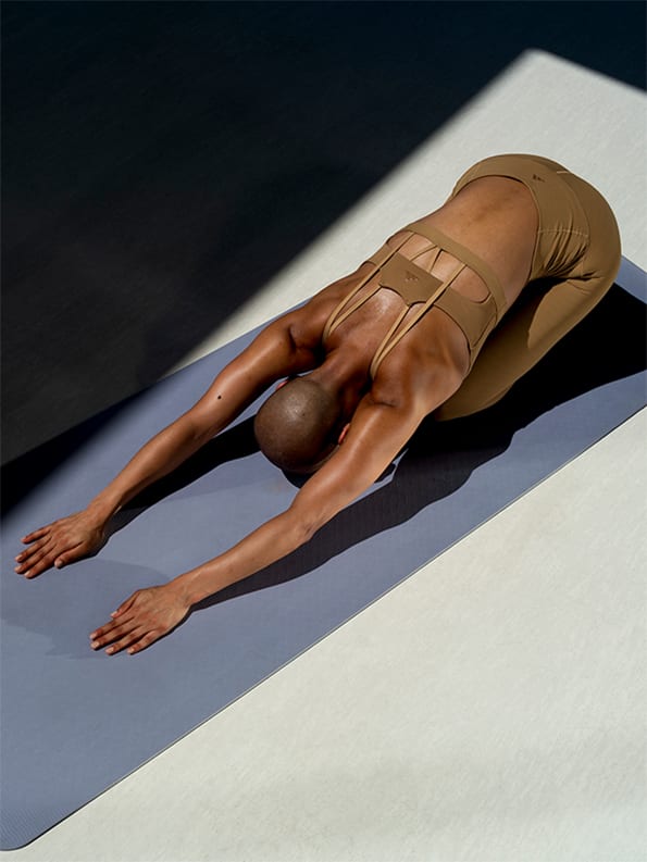 Female model working out in adidas yoga collection