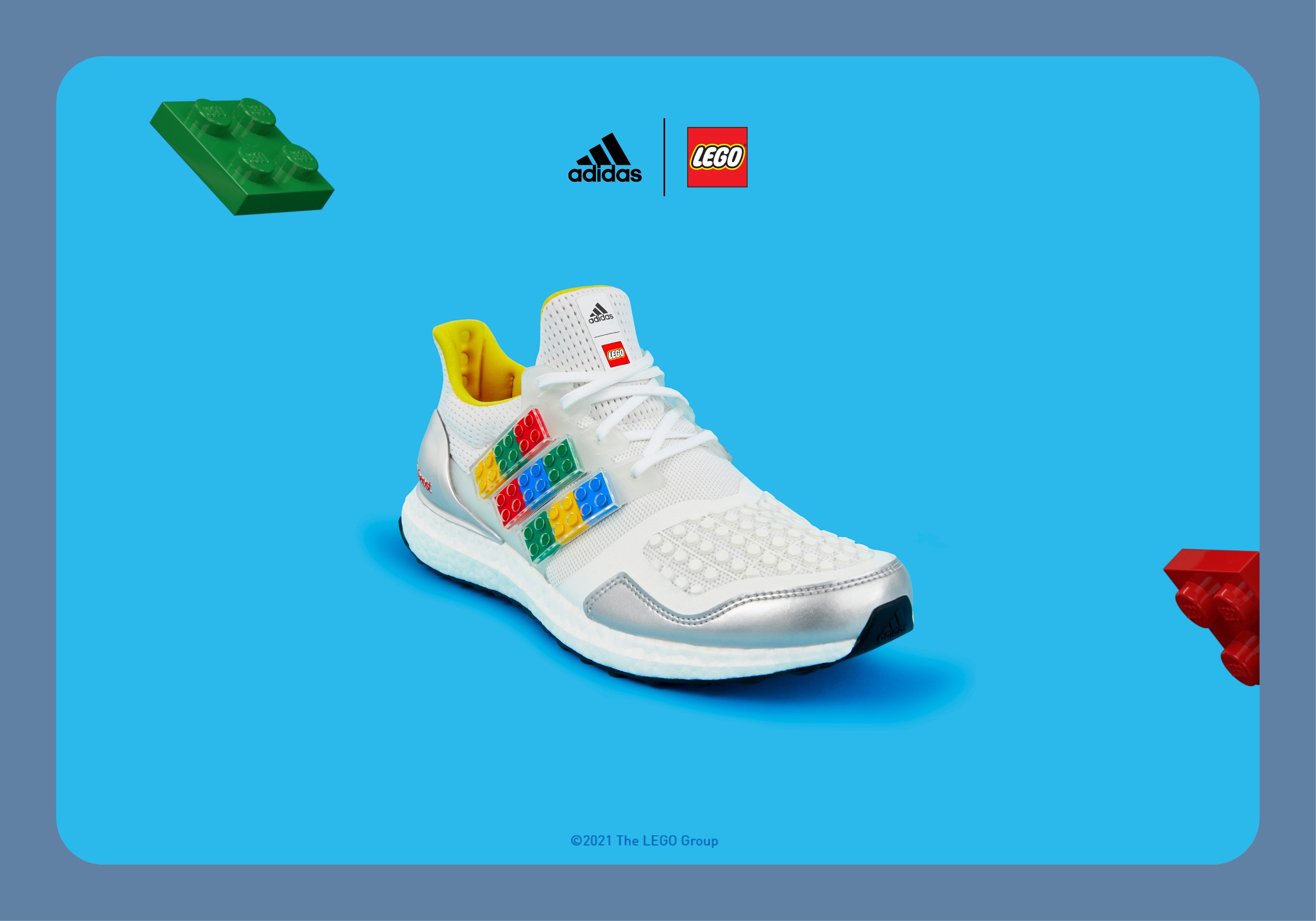 ultraboost dna plates trainers on a grey background with floating lego bricks