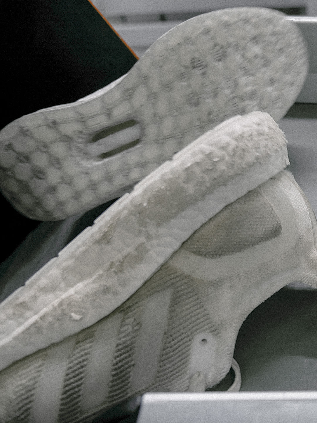 Made To Be Remade shoes being cleaned in the factory.
