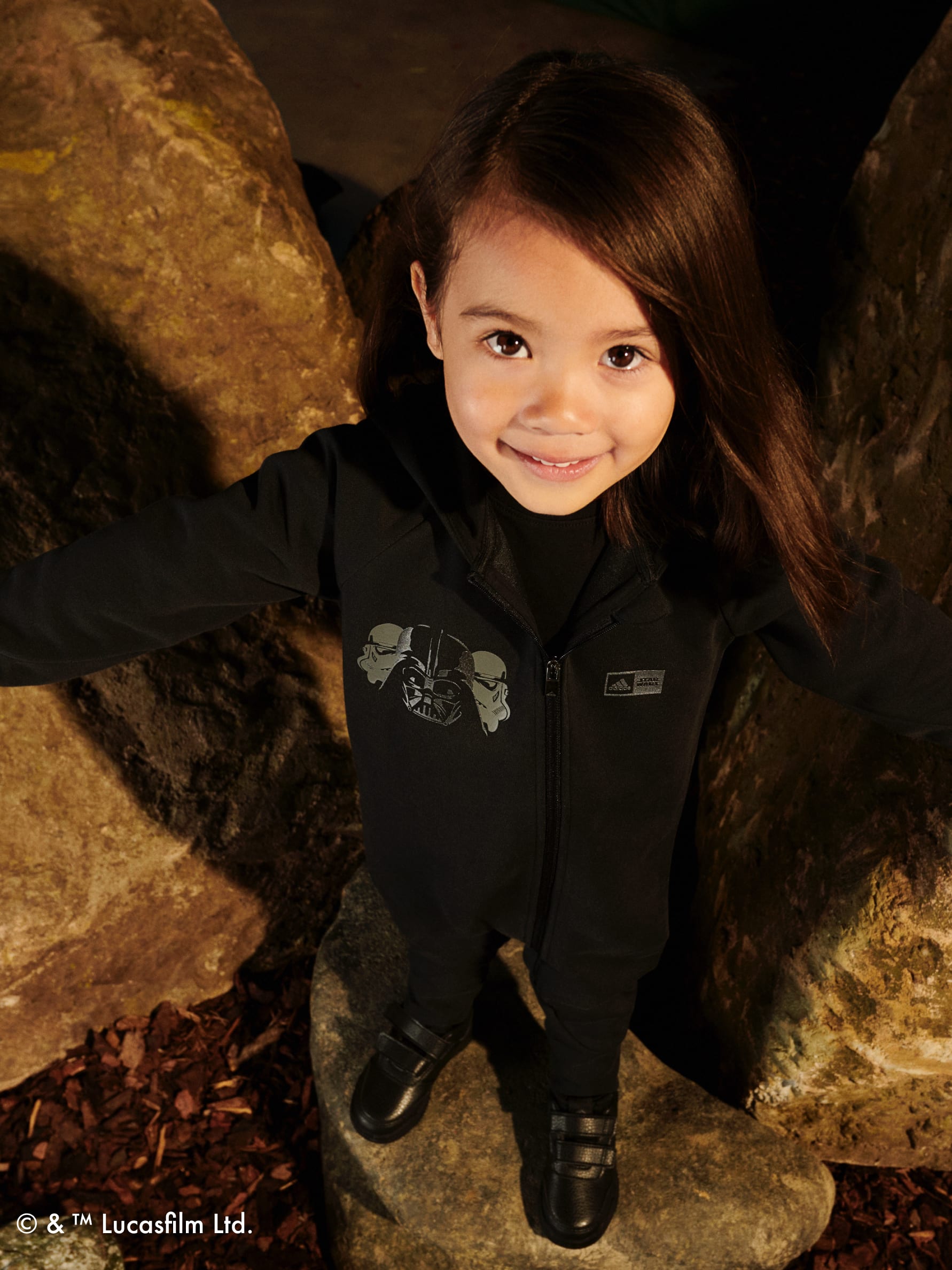Girl smiling at camera wearing adidas | Star Wars collection