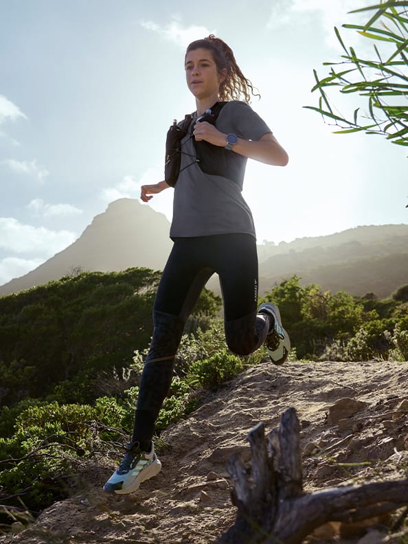 A person running on a rocky hill