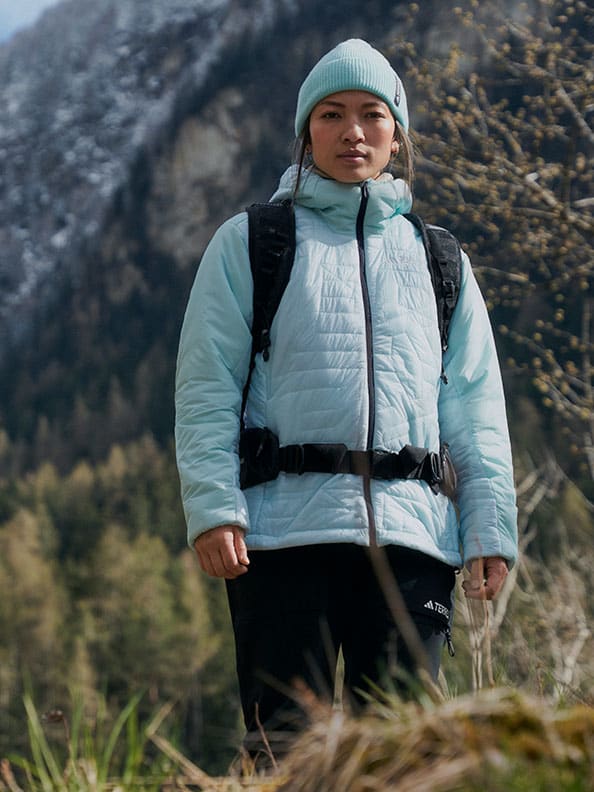 A person in a blue jacket and hat