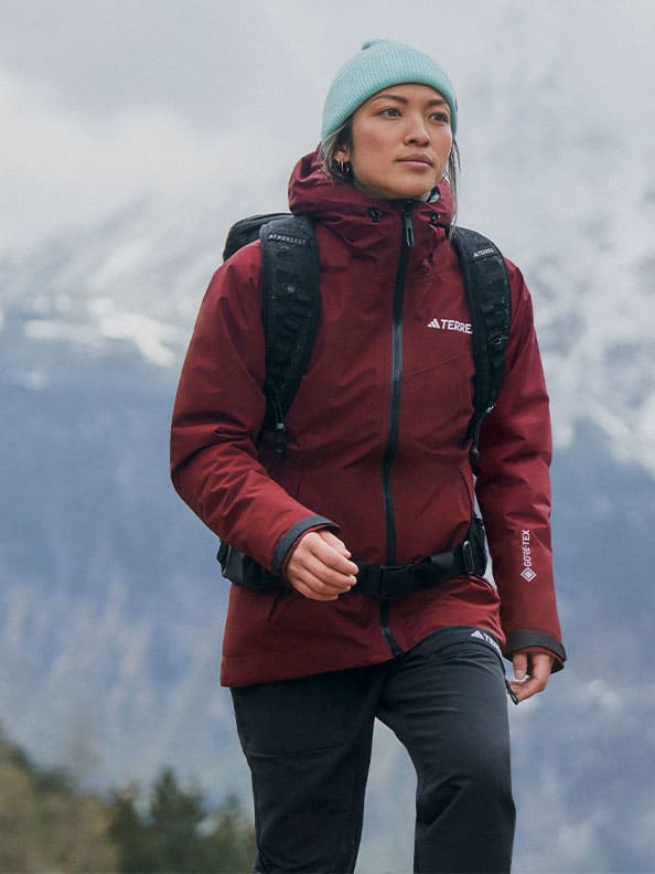 A person wearing a backpack and walking