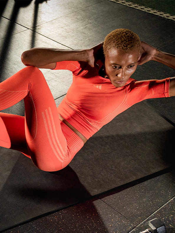 Female model working out in adidas training collection