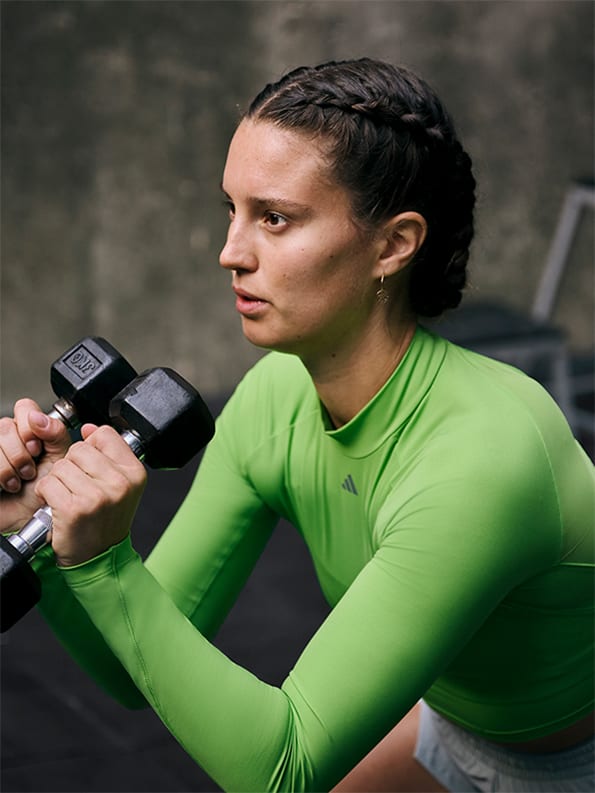 Female model working out in adidas training collection