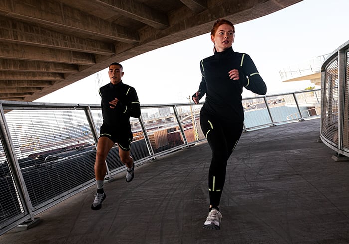 Two models running in a urban landscape
