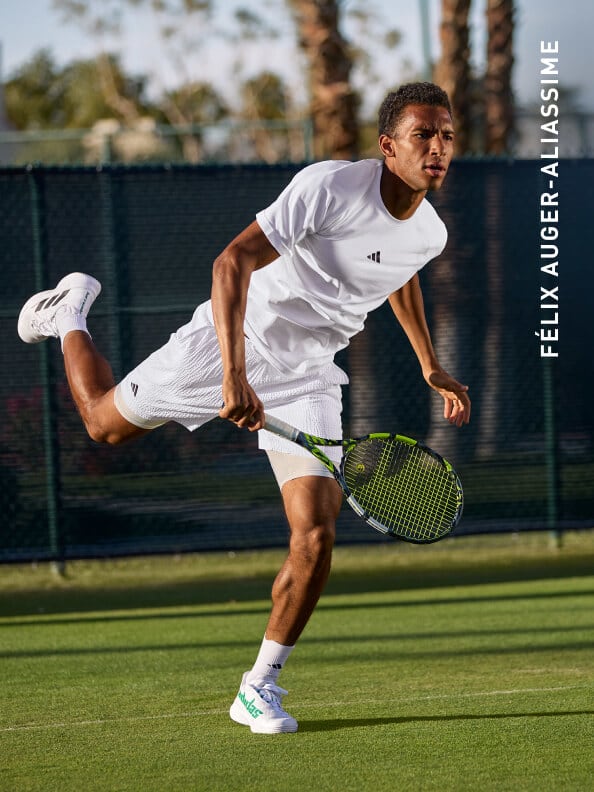 Félix Auger-Aliassime wearing the new adidas tennis english tournement outfit, playing tennis on the grass court