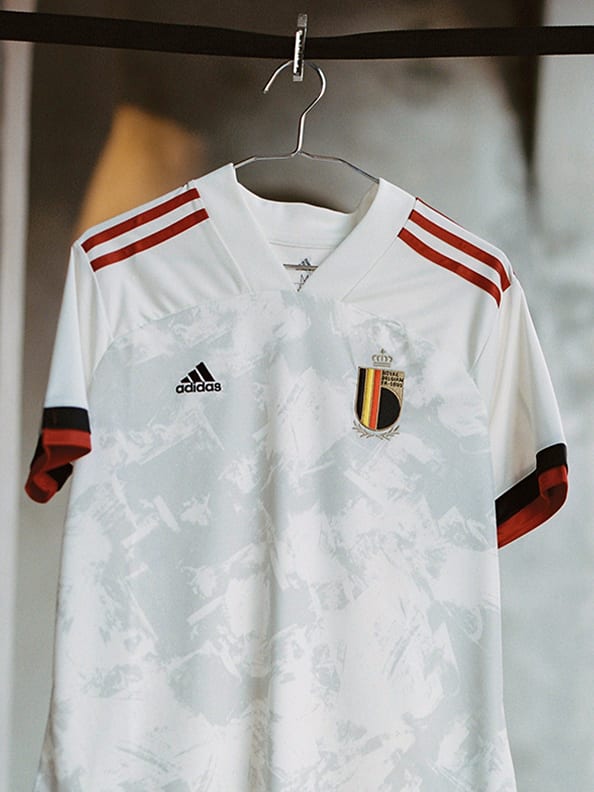 The new Belgium Away jersey is shown here. A modern masterpiece made for UEFA EURO 2020™, this adidas football jersey has an off-white design with red and black details.