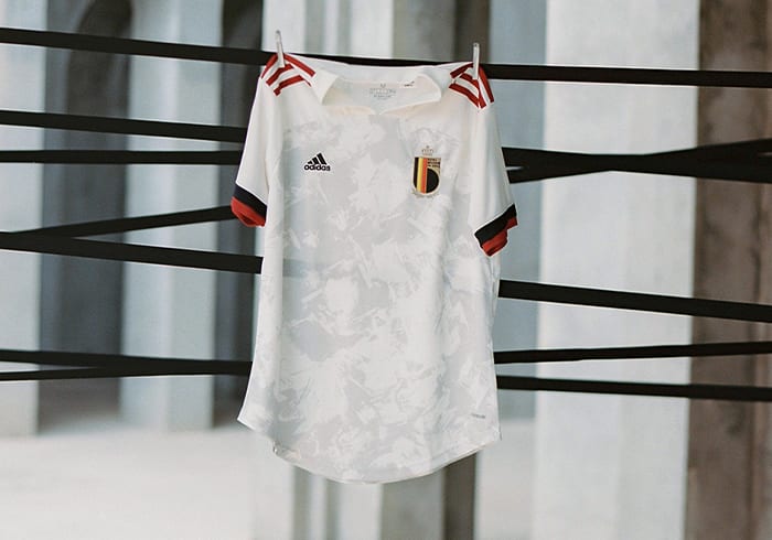 The new Belgium Away jersey is shown here. A modern masterpiece made for UEFA EURO 2020™, this adidas football jersey has an off-white design with red and black details.