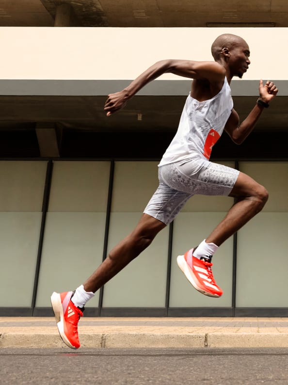 "[Pro 3] A side profile photo of a runner sprinting, he wears the Adizero Adios Pro 3 shoe."