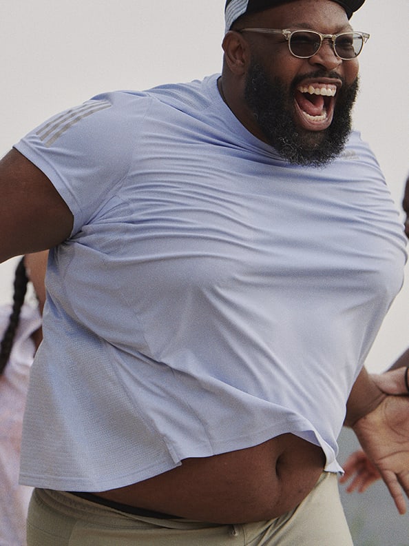 Man Martinus Evans laughing wearing adidas.