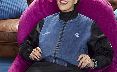 Girl smiling while wearing a jacket.