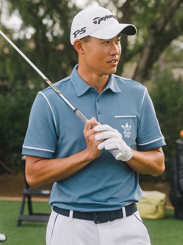 Professional golfer, Collin Morikawa in a blue polo.