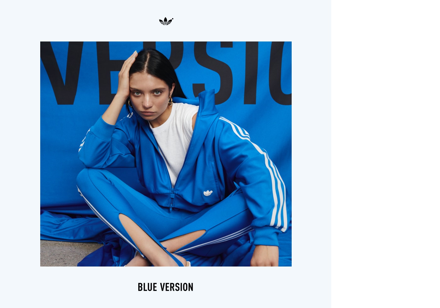 An image of Ganna Bogdan sitting cross-legged sporting the Blue Version Beckenbauer tracksuit in bluebird.