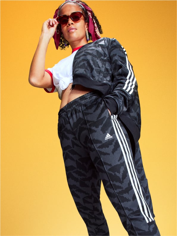 Soccer player Mary Fowler posed in adidas tracksuit while wearing sunglasses.