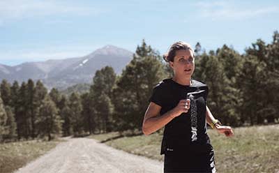 Professional trail runners reaching their summit