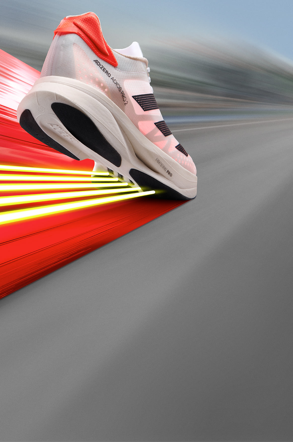 Adizero running shoes on the street with text