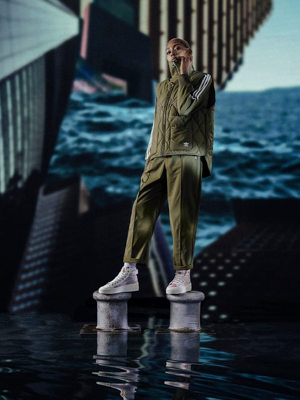 A woman standing in a full parley missions outfit