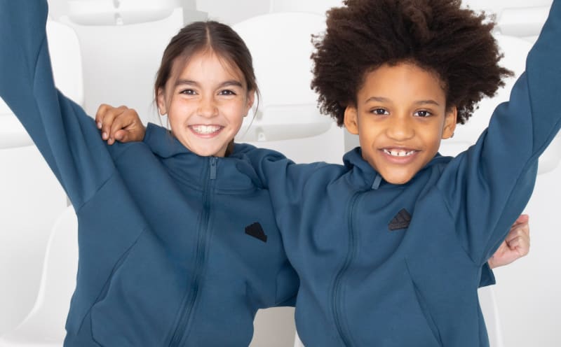 Boy and Girl model wear Z.N.E. Sportswear hoodies.
