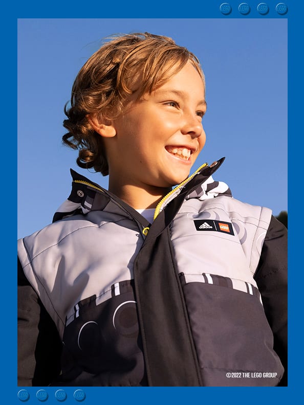 Smiling boy in black and grey Winter jacket