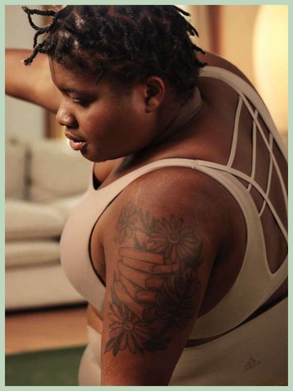 JESSAMYN STANLEY WEARS STUDIO MEDIUM SUPPORT. It moves comfortably with her as she flows through her vinyasas.