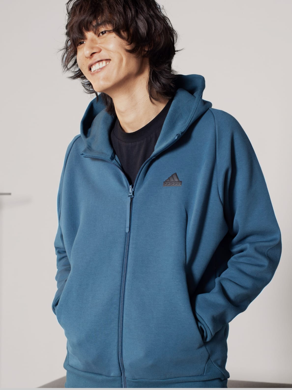 Male model wears Z.N.E. Sportswear hoodie.
