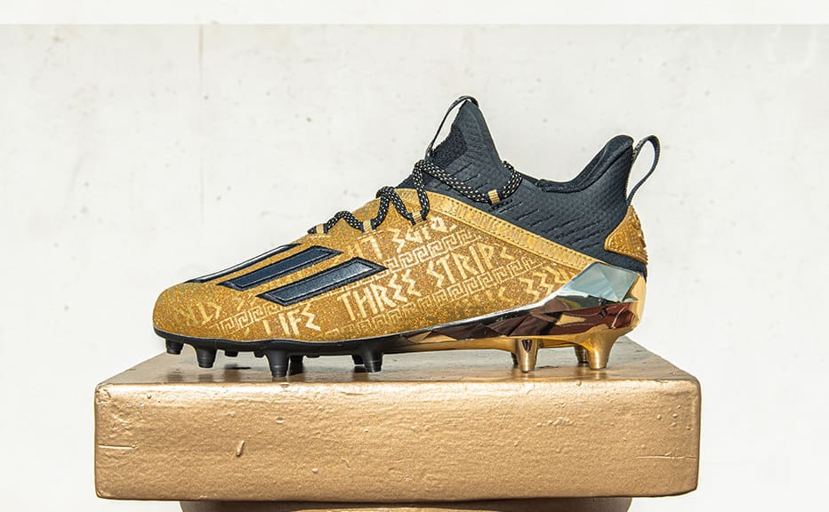 gold and white adidas football cleats