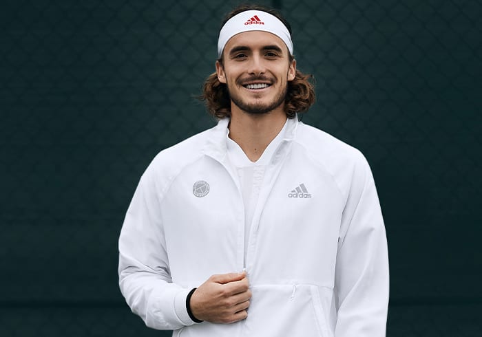 Male tennis player wearing the UNIFORIA jacket