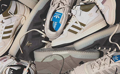 A digital collage of various adidas Forum sneakers
