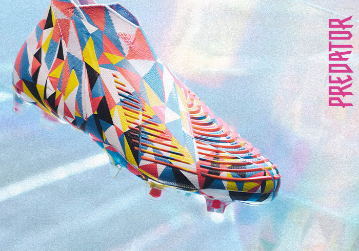 A visual of the laceless Predator football boot on a textured background.