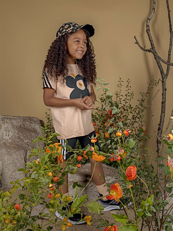 Child wearing adidas x Marimekko clothing