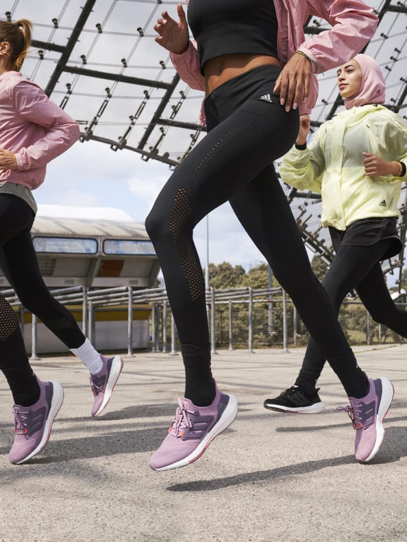 Close up of two women running with the new Ultraboost 22 running shoe
