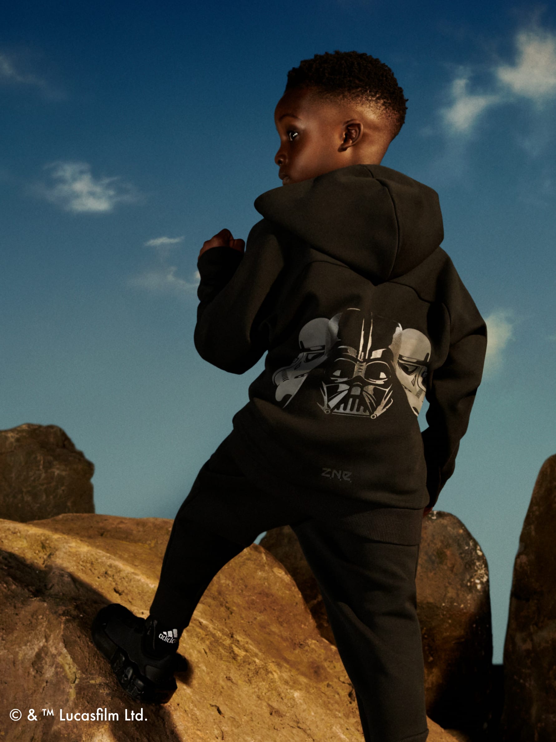 Back of boy with graphic on hoodie wearing adidas | Star Wars collection